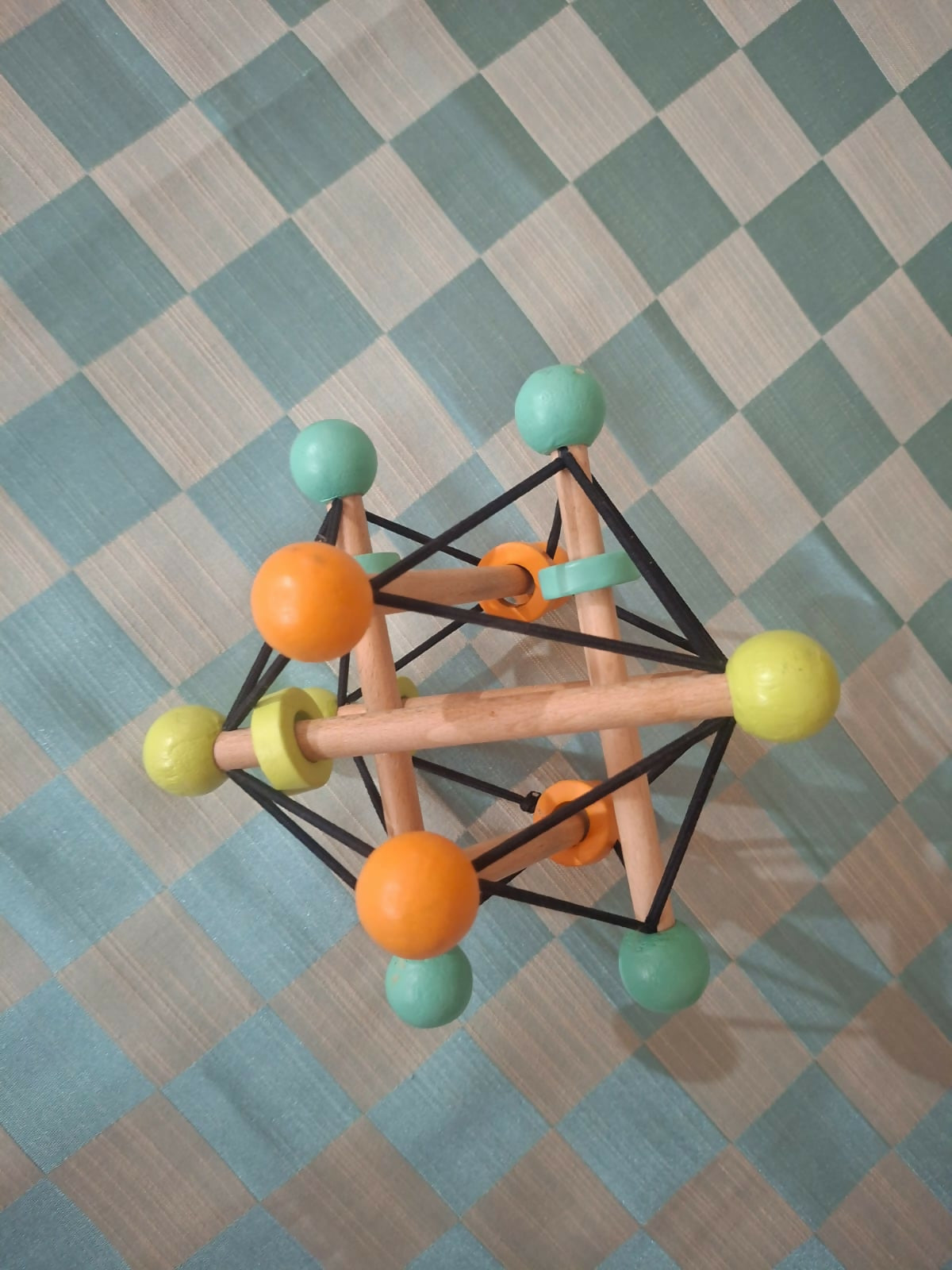 Curious cub geometric rattle ball toy