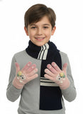 Child wearing a gray sweater, black and white striped scarf, and gloves with cartoon designs