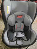 Gray LuvLap children's car seat on a textured surface