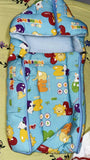 Children's sleeping bag with animal prints on a light green background