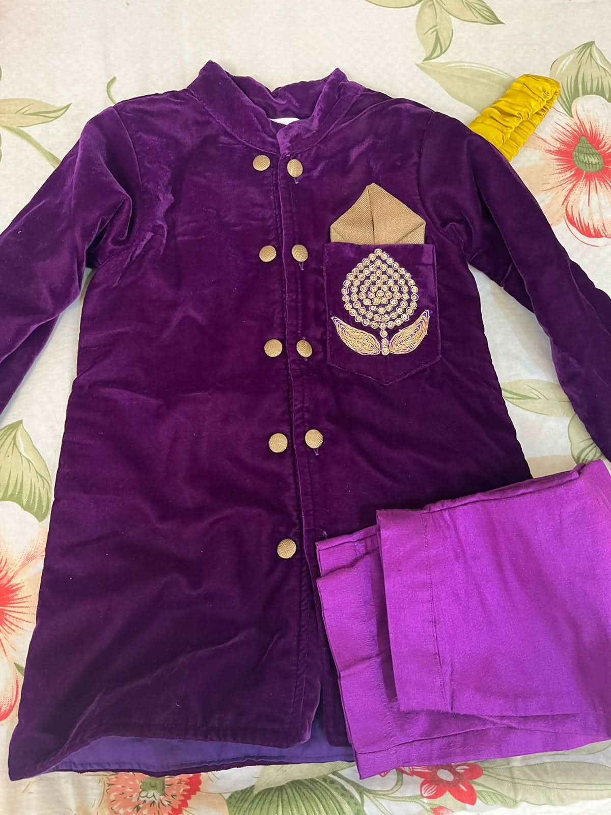 Elegant purple baby sherwani with intricate detailing, soft fabric, and comfortable fit, perfect for festive occasions and celebrations.