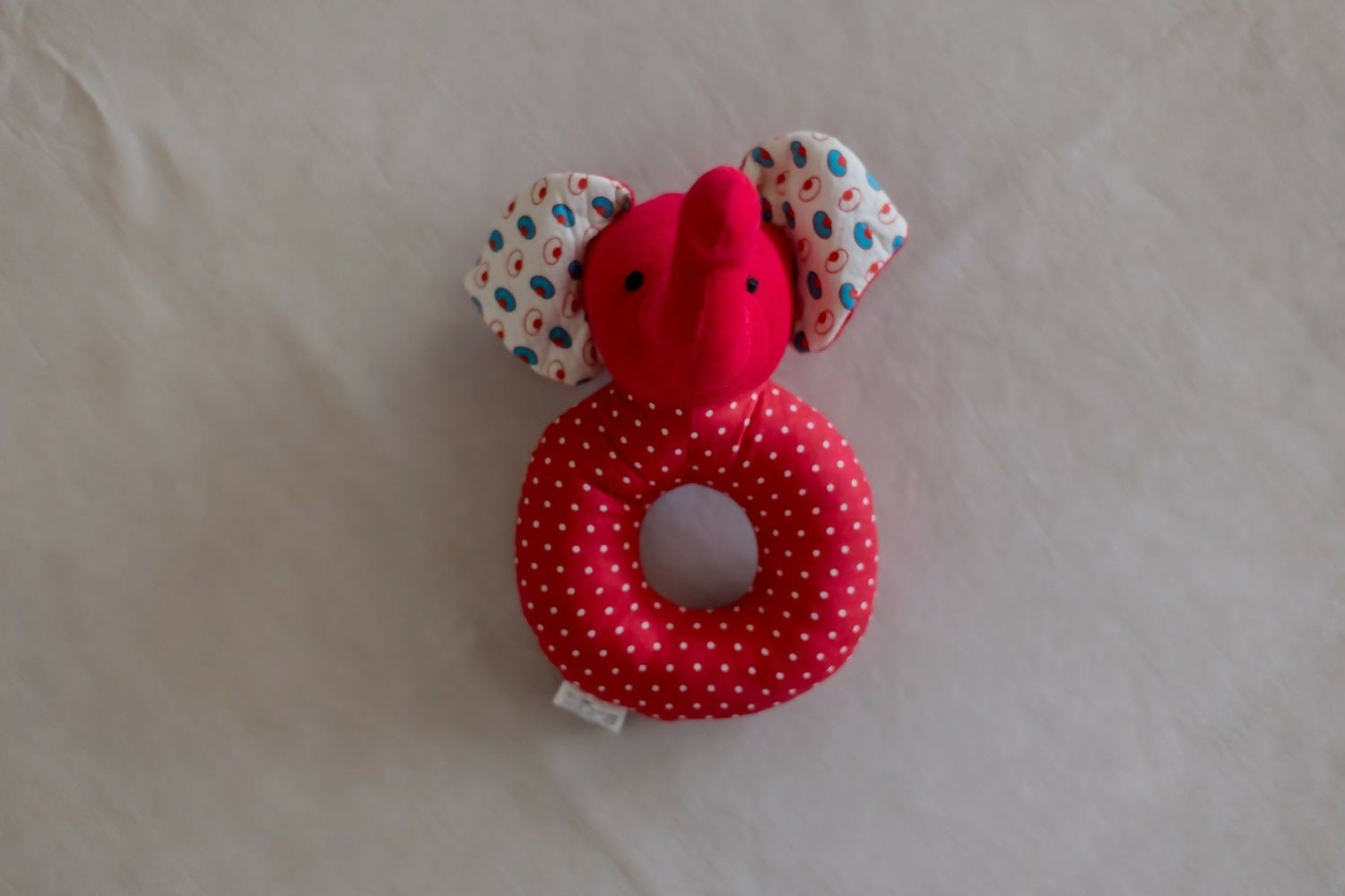 Introducing our Elephant Faced Shape Rattle, a delightful and eco-conscious sensory toy crafted with care and consideration.