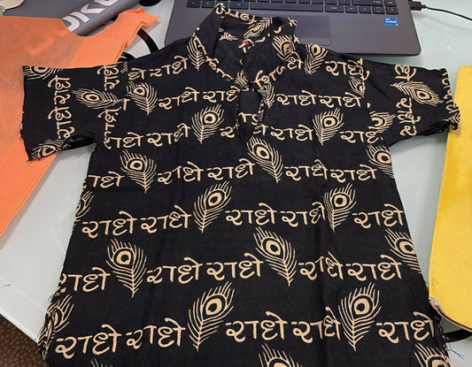 Black dress with gold patterns on a table