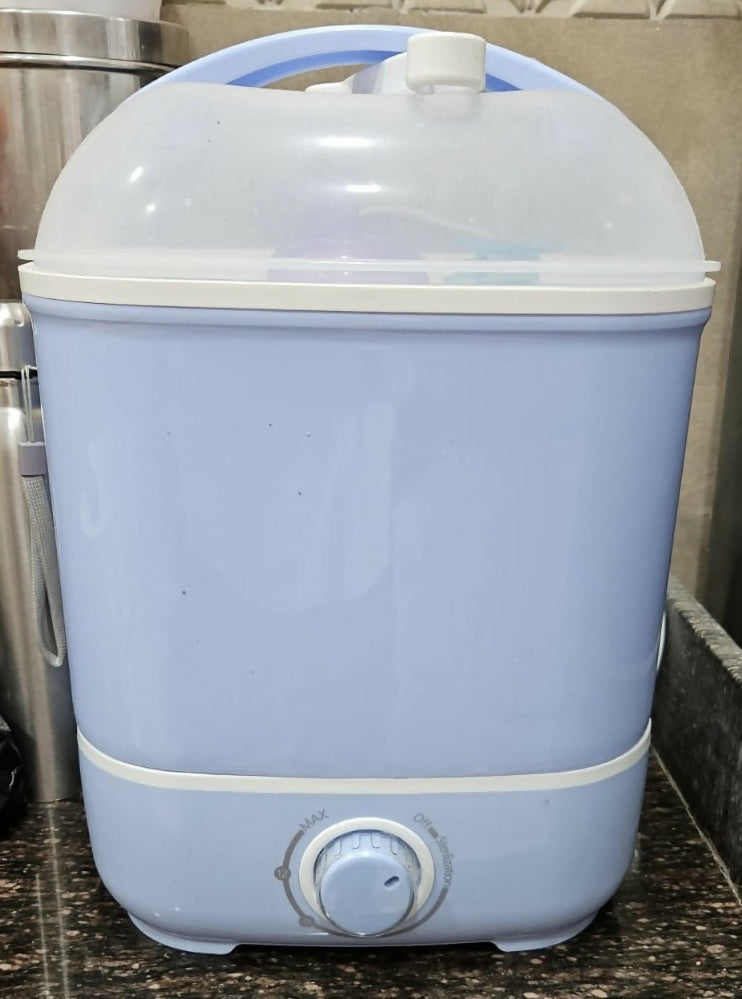 Blue and white humidifier on a kitchen counter
