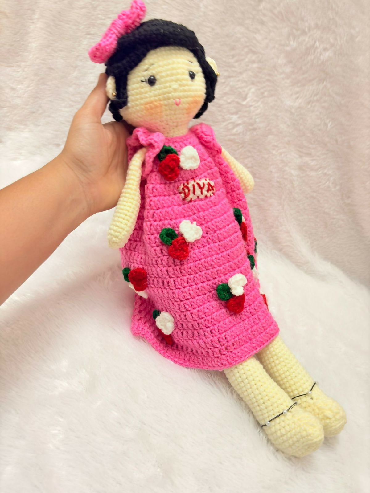Personalised baby doll with soft hair and custom name embroidery – perfect gift for infants and toddlers.