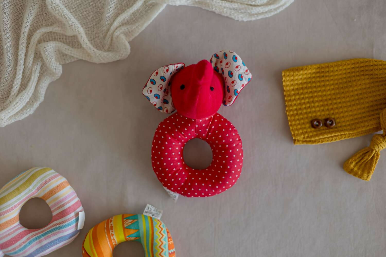 Introducing our Elephant Faced Shape Rattle, a delightful and eco-conscious sensory toy crafted with care and consideration.