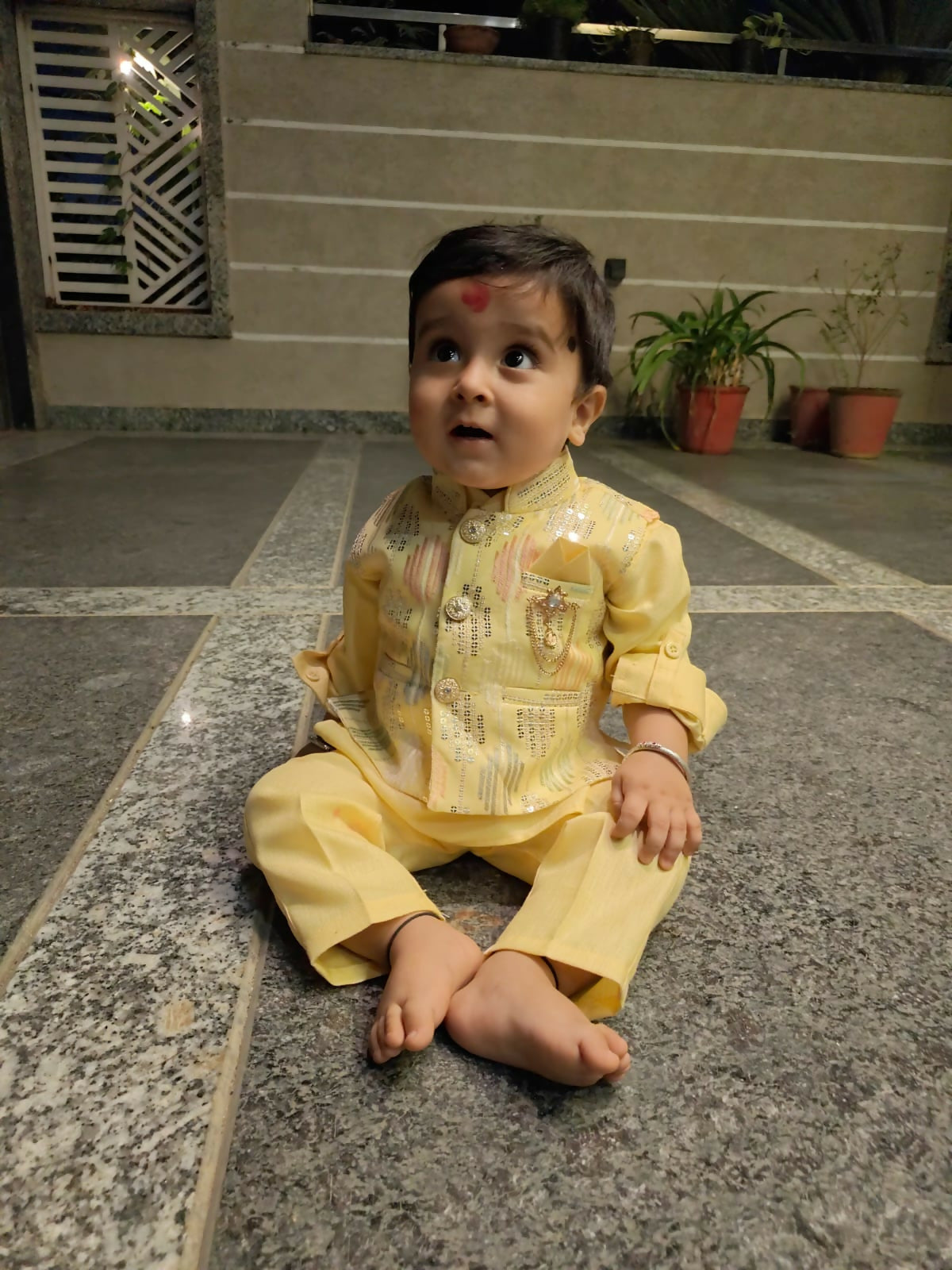 Child in a yellow traditional outfit