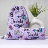 Purple drawstring bag with 'Devaki' branding and butterfly designs, next to a pouch with similar design.