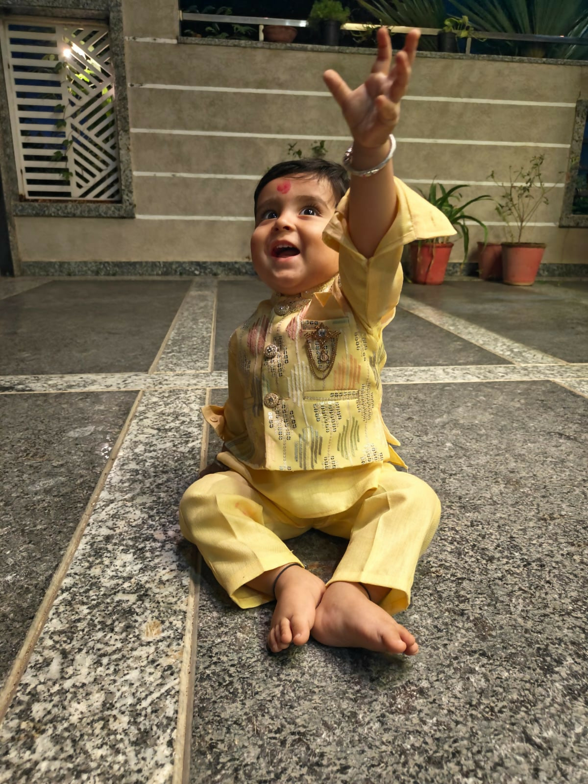 Child in a yellow outfit