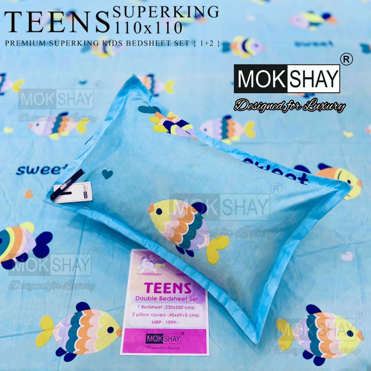 Mokshay Teens double bedsheet set with pillow cover on a blue background with fish patterns.