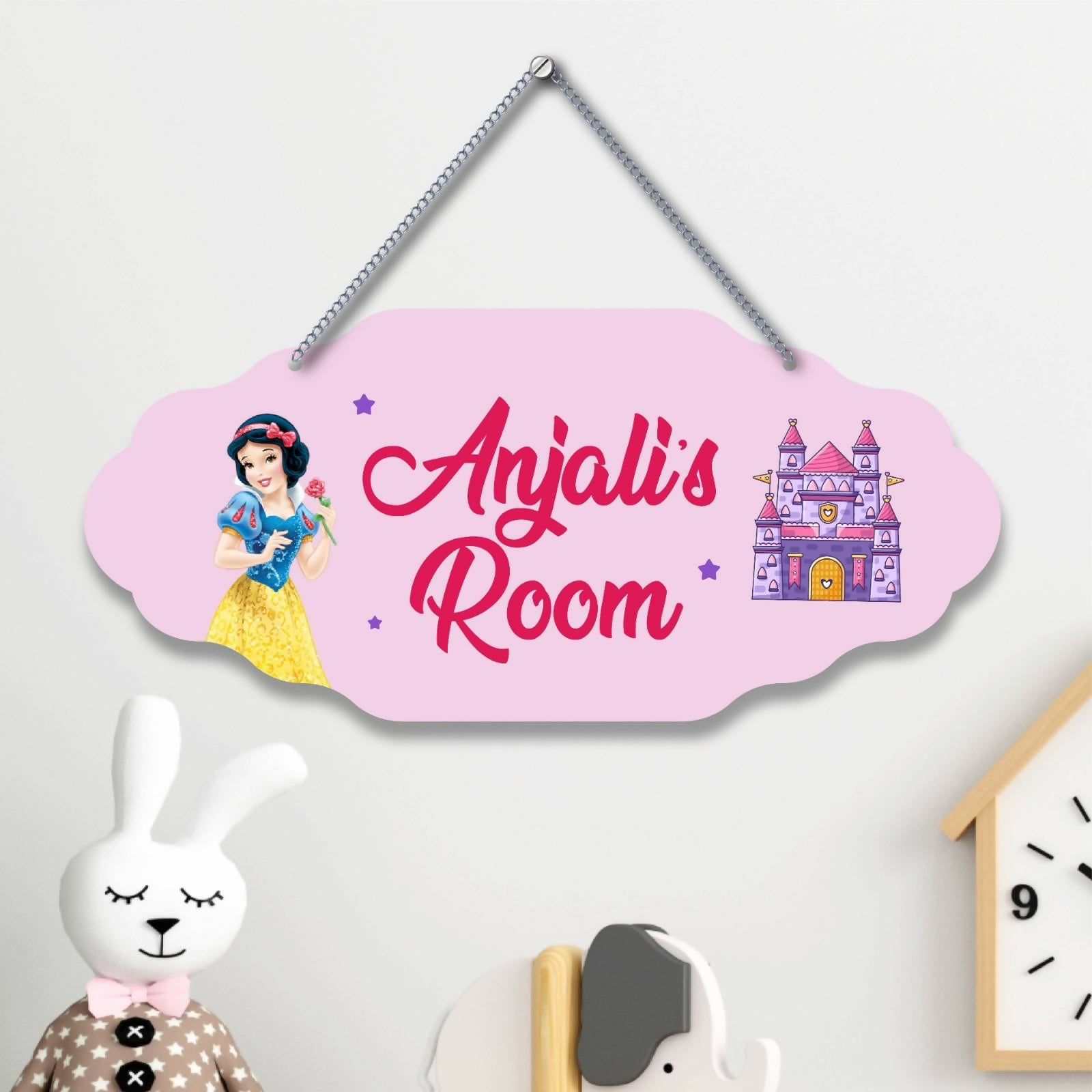 Pink personalized room sign with cartoon character and castle design