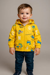 Child wearing a yellow jacket with colorful designs