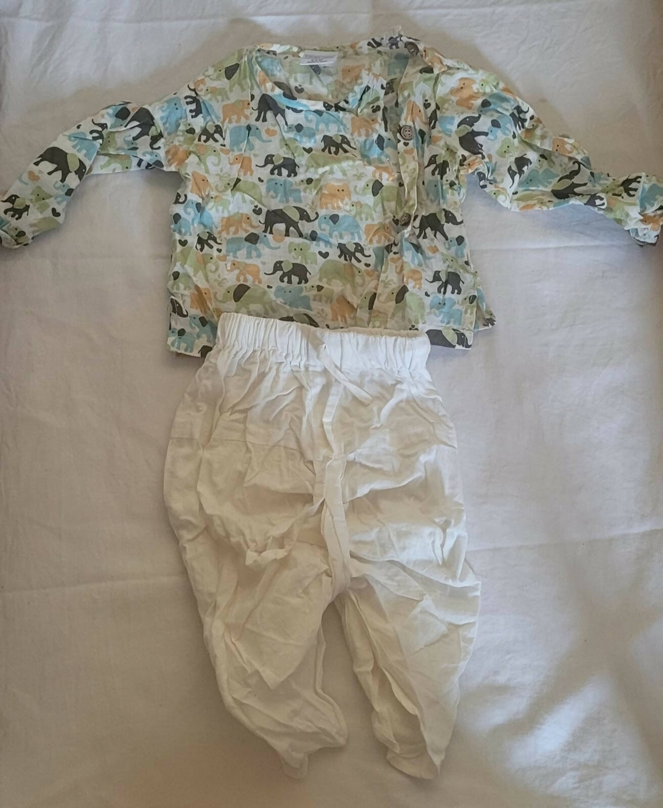 Add a touch of charm to your little prince's wardrobe with the Polka Dots Baby Boy Kurta Dhoti - perfect for festive celebrations and special occasions!