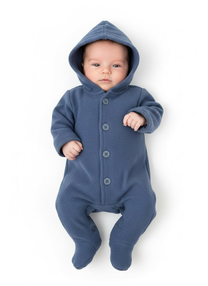 Baby wearing a blue hooded onesie 