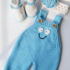 Knitted blue baby romper , white booties, and flower 