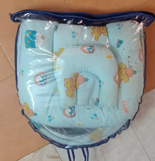 Baby seat with cartoon design on a tiled floor