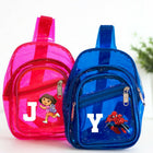 Pink and blue transparent backpacks with cartoon characters on a white background