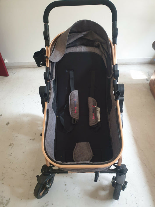 3-in-1 Z Fold Luxury Stroller—sleek grey design, explosion-proof wheels, and easy portability for comfort and style.