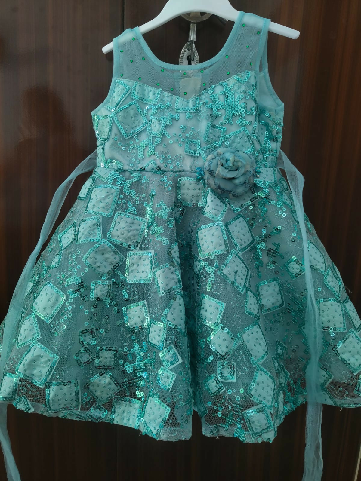 Teal dress with floral details 