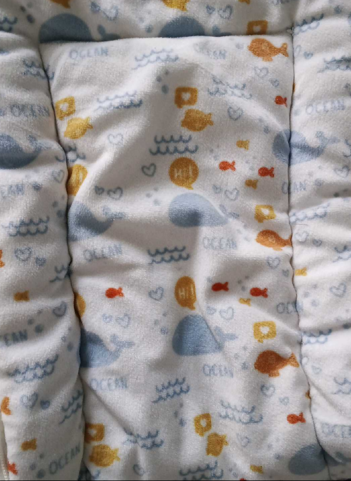 Baby blanket with animal patterns on a white background