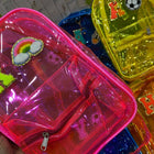 Clear plastic bags with colorful letter decorations in various colors.