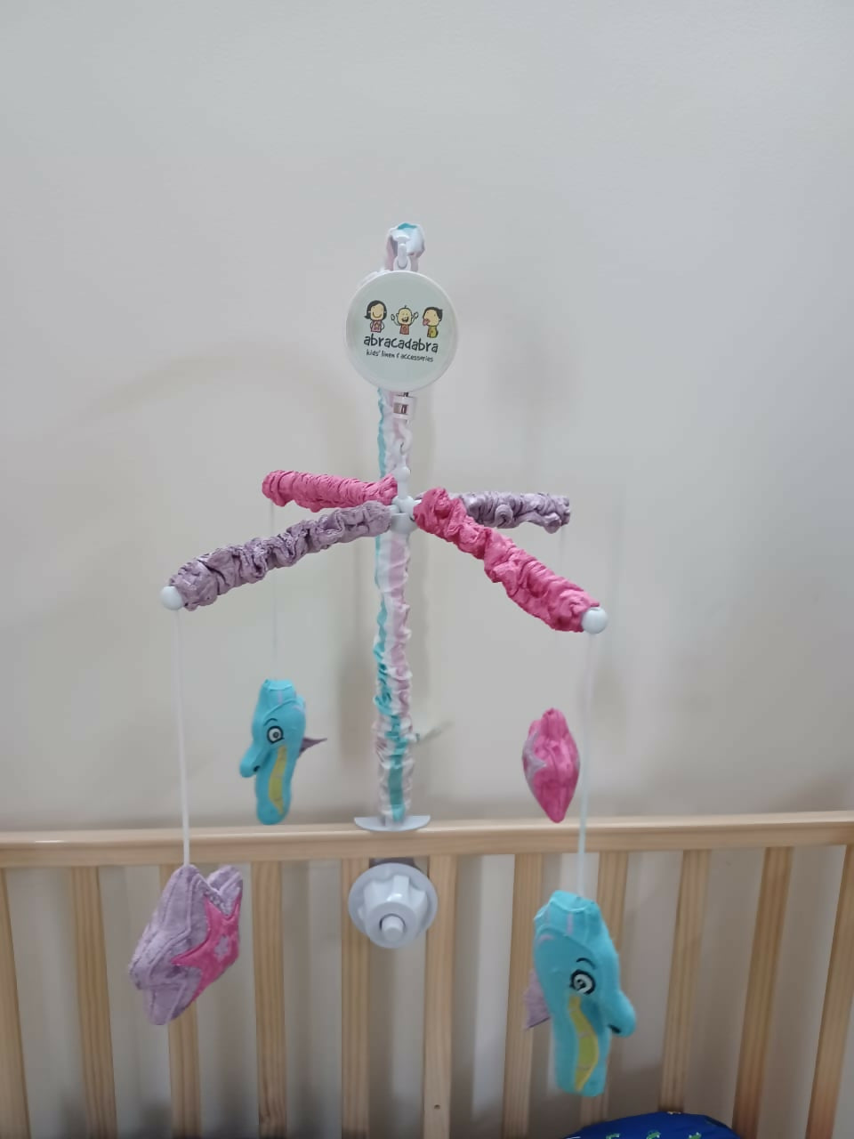 Soothe your baby to sleep with the enchanting Abracadabra Musical Cot Mobile—featuring adorable mermaids, soft melodies, and calming motion!