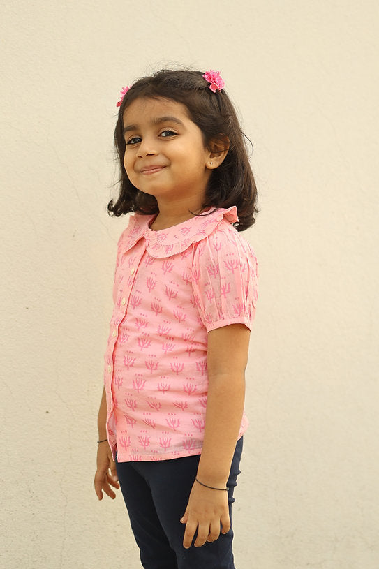 Discover the soft pink 100% cotton Peter Pan collar top for girls, offering breathable comfort and timeless style for casual and special occasions.