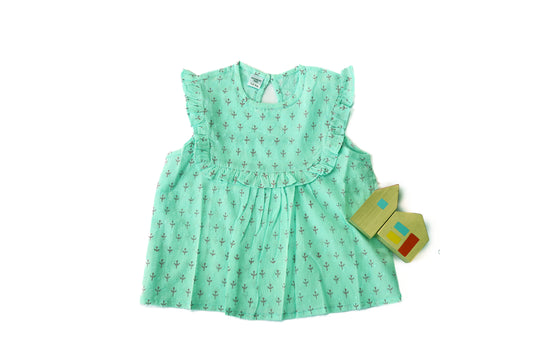 Discover our 100% cotton sea green frill top for girls, offering soft, breathable comfort with a stylish design perfect for any occasion.