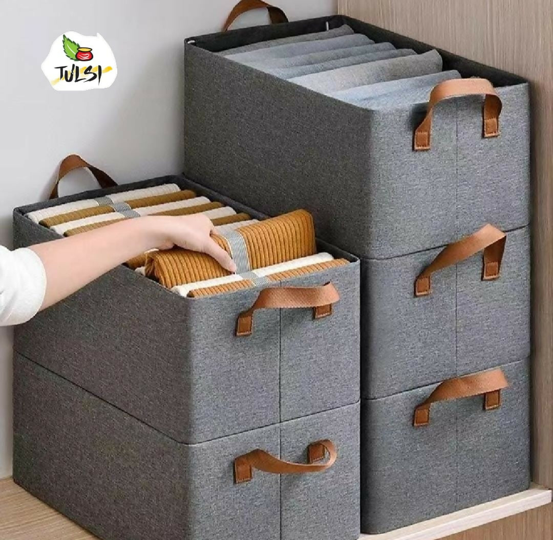 Gray storage boxes with brown handles on a wooden surface, featuring the Julsi brand logo.