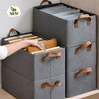 Gray storage boxes with brown handles on a wooden surface, featuring the Julsi brand logo.