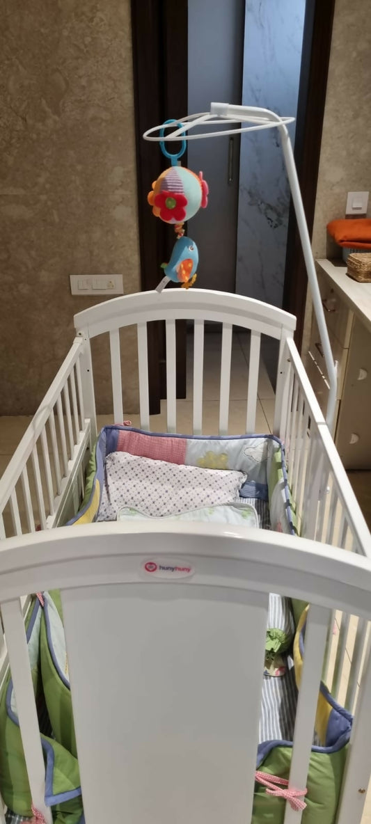 Discover the HUNY HUNY Baby 12 In 1 Pinewood Crib with Mosquito Net and Adjustable Stand – versatile, durable, and perfect for your growing baby's needs.