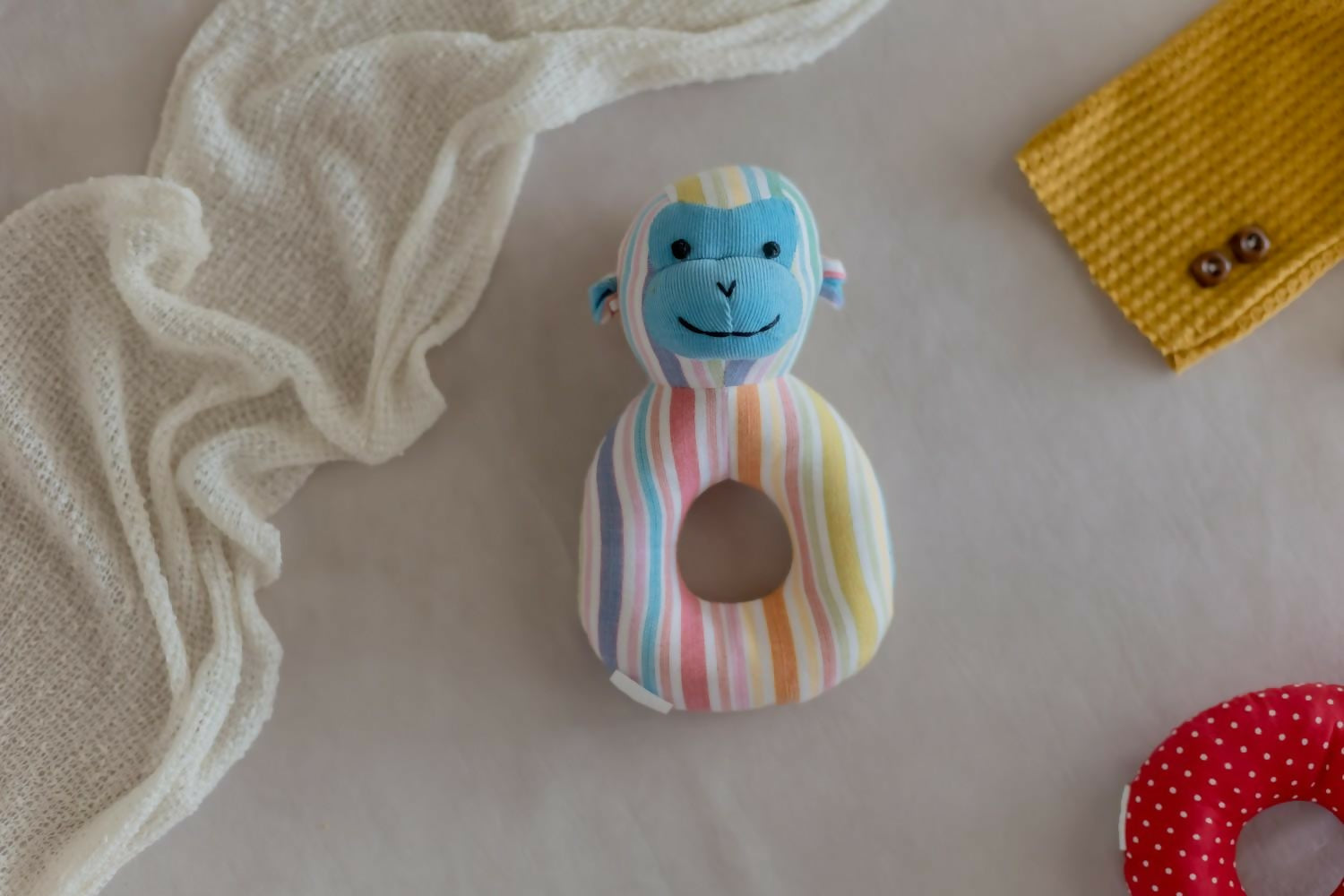 Introducing our Monkey Faced Shape Rattle, a delightful and eco-conscious sensory toy crafted with care and consideration.