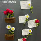 Fridge magnets shaped like flowers and pots 