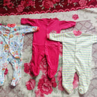 Set of 3 baby rompers in pink and multicolor prints, soft fabric, almost new condition
