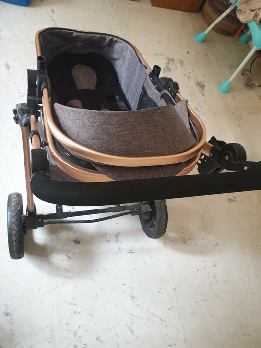 3-in-1 Z Fold Luxury Stroller—sleek grey design, explosion-proof wheels, and easy portability for comfort and style.