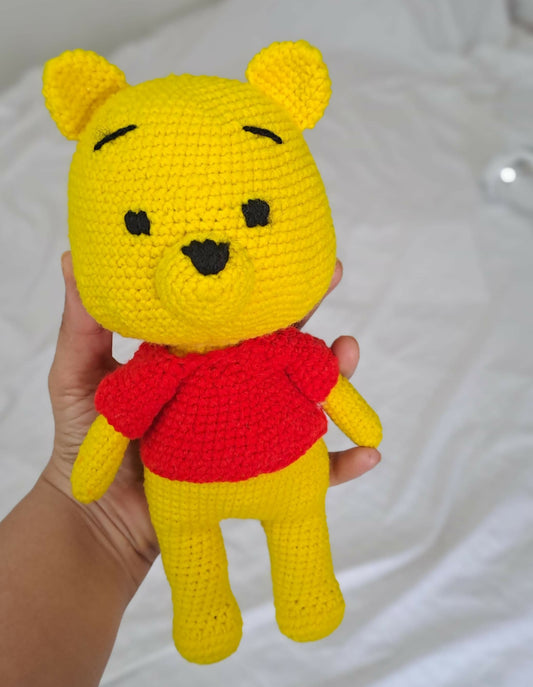Discover the magic of the Hundred Acre Wood with the Winnie the Pooh Soft Toy, crafted from plush materials for cuddly comfort and endless adventures.