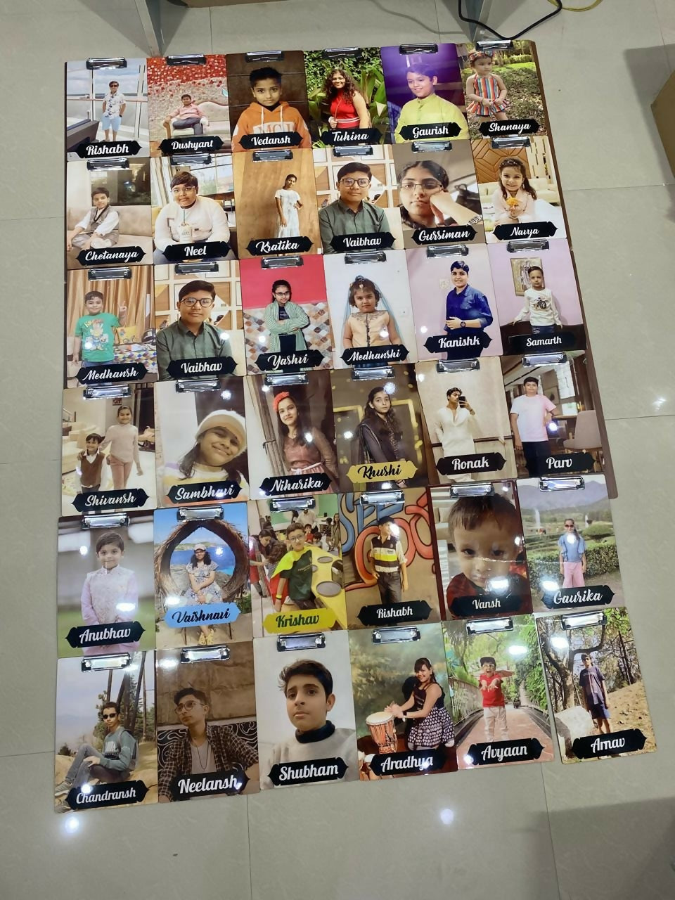 Poster with multiple small images of people with names below each