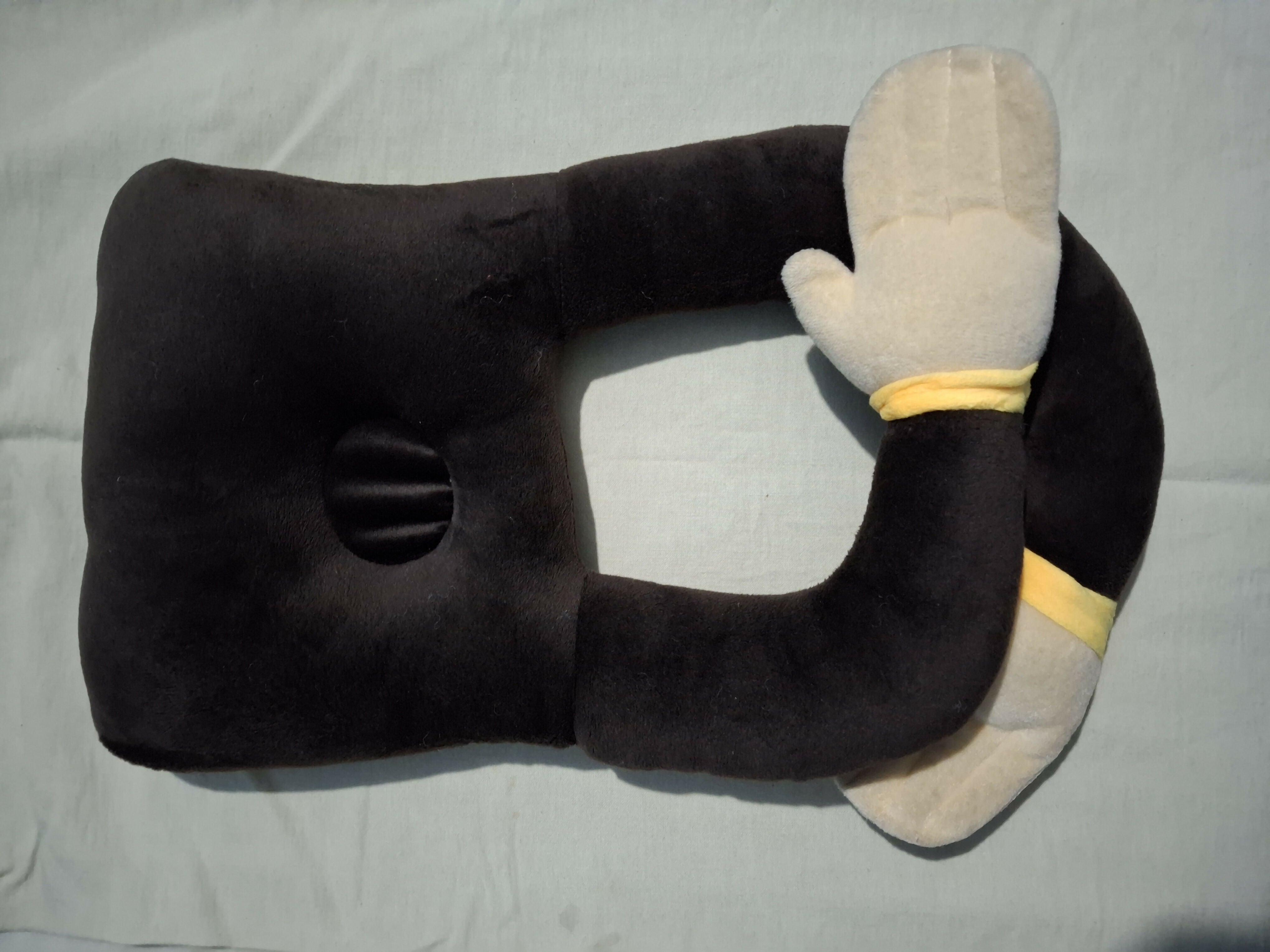 U-shaped pillow with a plush animal head 