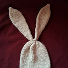 Knitted beige bunny hat with ears 