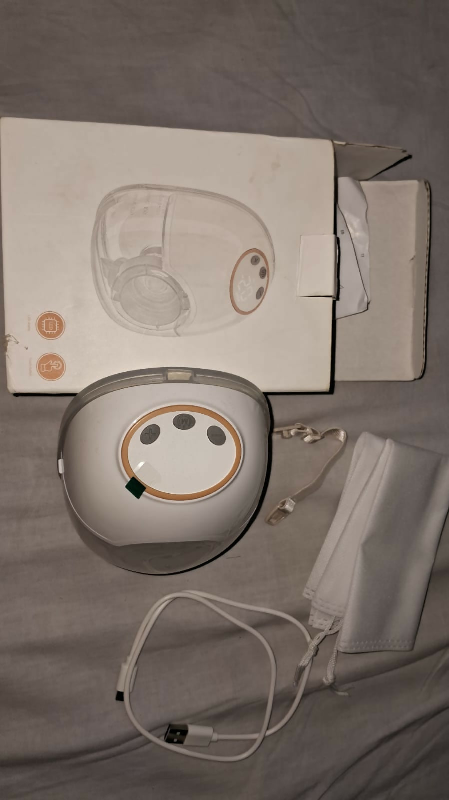 AENTIK YW-788 electric wearable breast pump with hands-free design, compact milk collection cups, adjustable suction settings, and portable pumping support for breastfeeding mothers.