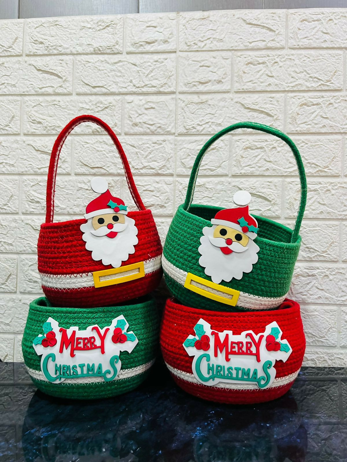 Two Christmas-themed baskets with Santa faces and 'Merry Christmas' text 