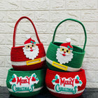 Two Christmas-themed baskets with Santa faces and 'Merry Christmas' text 