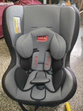 Gray and black car seat with LuvLap branding on a concrete floor.