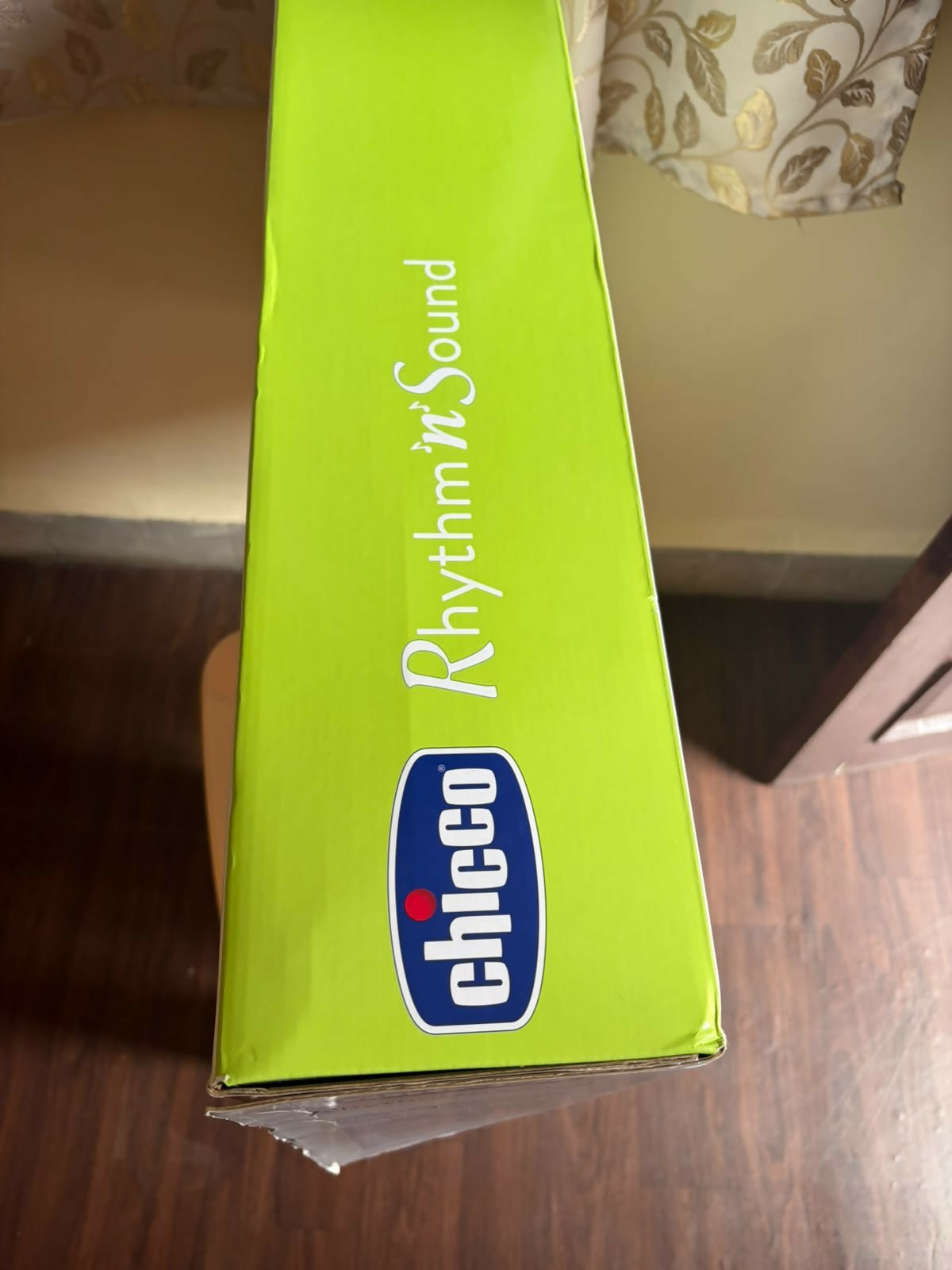 CHICCO Rhythm N Sound Baby Electric Swing with gentle automatic swinging, adjustable speed settings, soothing melodies, padded seat, safety harness, and sturdy frame for relaxing and comforting babies.