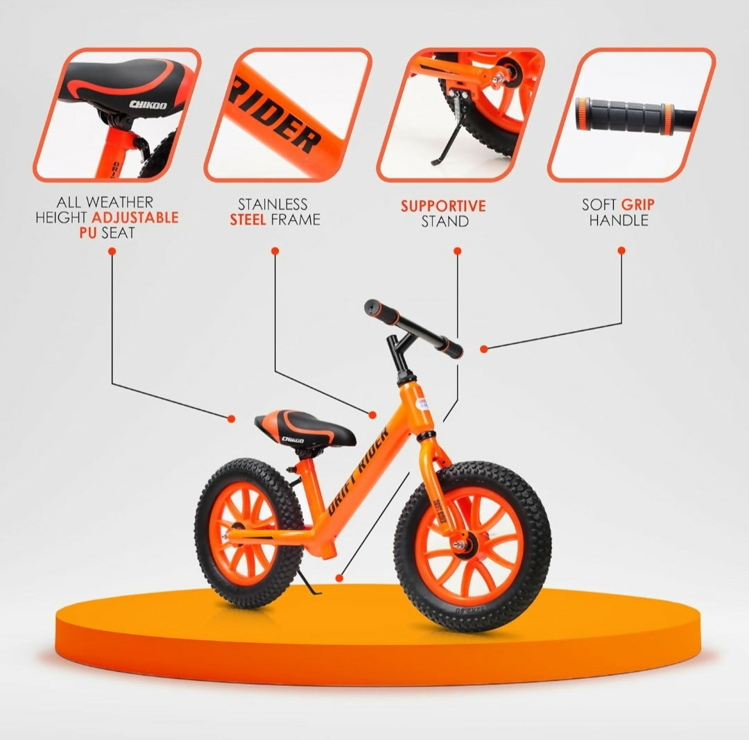 Orange balance bike with features highlighted on a white background