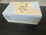 White box with 'Little Plum' branding on a dark surface