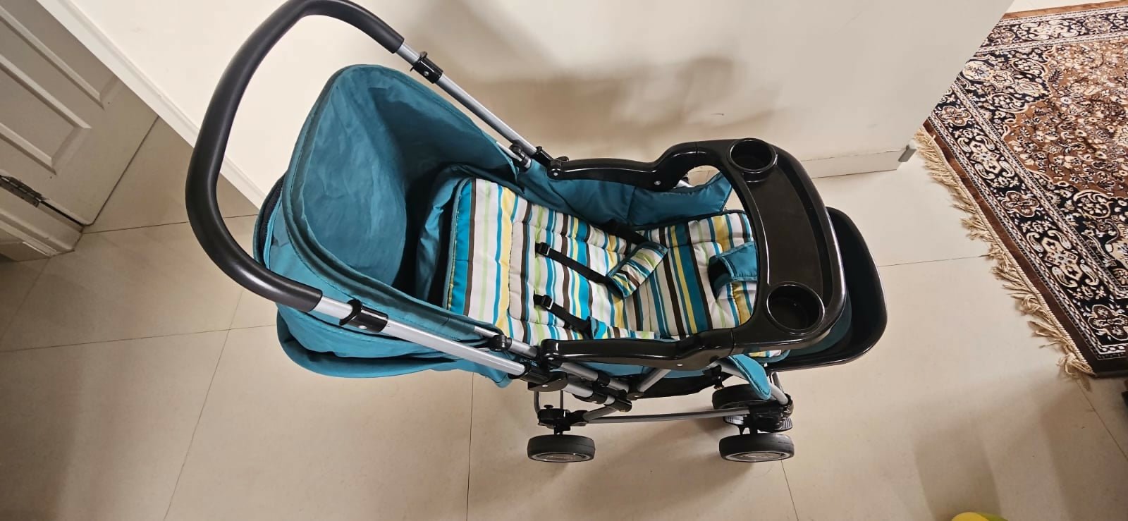 BABYHUG 2-in-1 Rock & Roll Stroller/Pram Cum Rocker with a convertible stroller and rocker design, reclining seat, reversible handle, adjustable canopy, 5-point safety harness, and foldable frame for versatile everyday use.