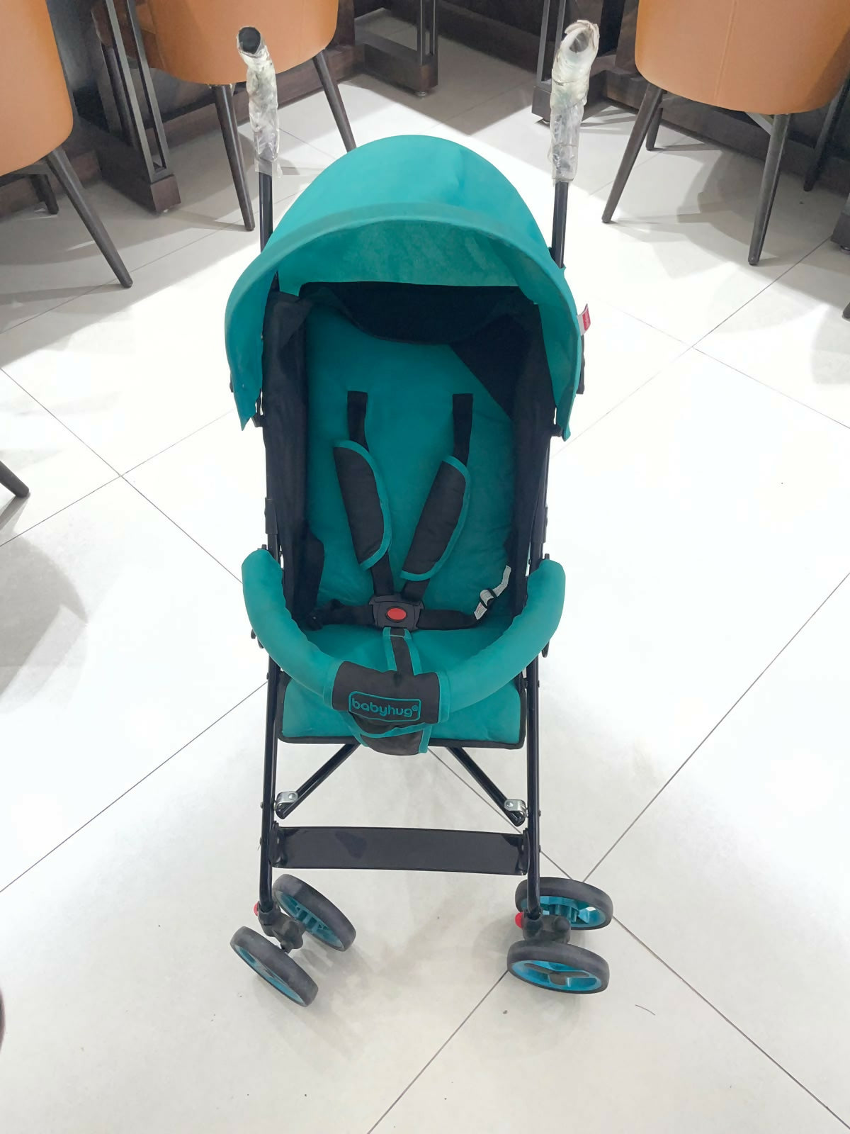 BABYHUG Agile Lightweight Baby Stroller in Blue & Black, Preloved New condition, featuring compact umbrella fold, adjustable canopy, rear wheel brakes, front swivel wheels, and a travel-friendly design for convenient outings.