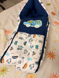 BABYHUG Premium Muslin Sleeping Bag in Blue with Bus Print, Almost New condition, featuring soft muslin fabric and a cozy wearable design for keeping babies comfortably covered during supervised rest and naps.