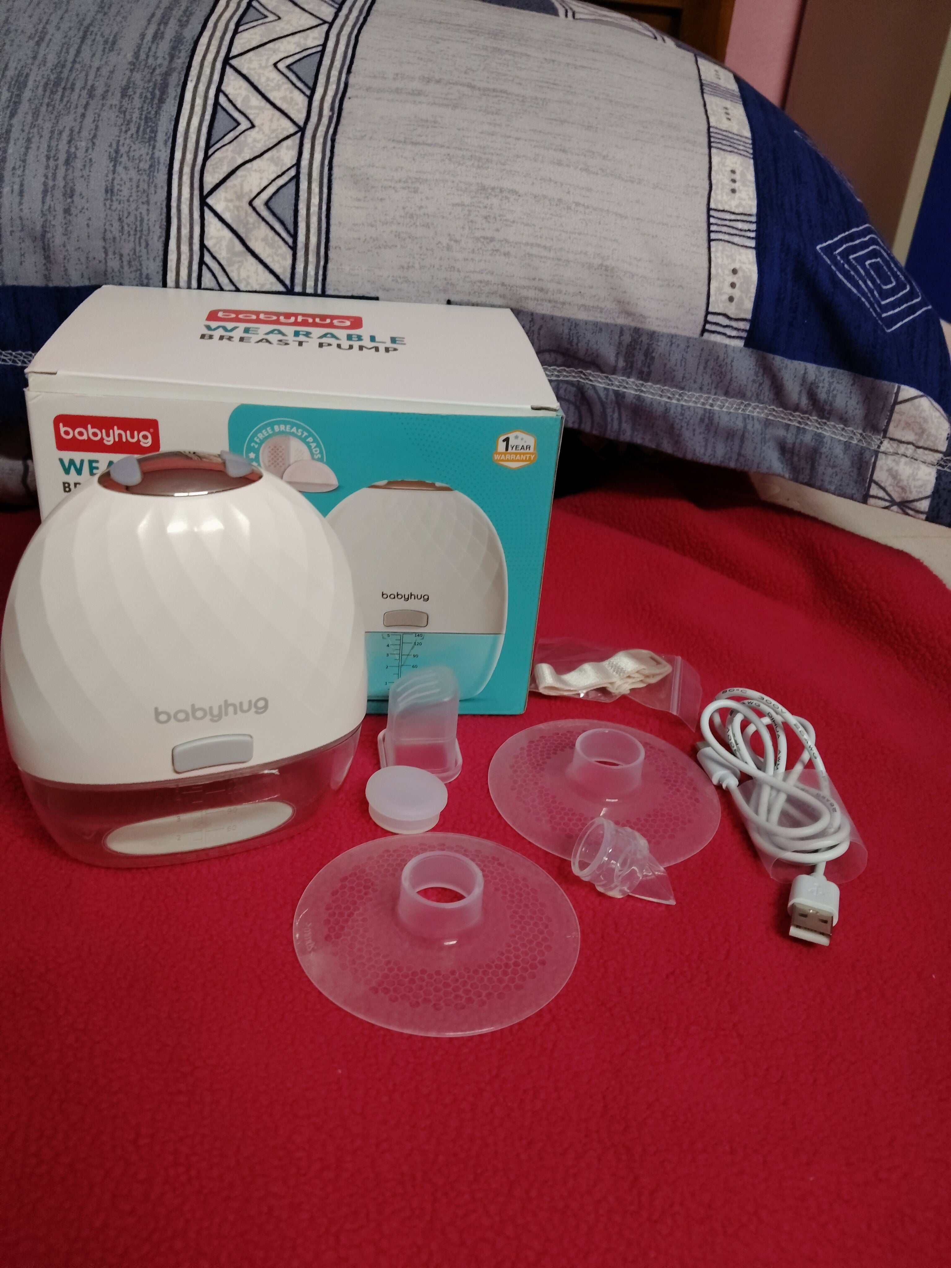 BABYHUG Wearable Electric Breast Pump in Preloved New condition featuring a compact hands-free design, convenient electric operation, adjustable pumping settings, and comfortable fit for flexible everyday breast milk expression.